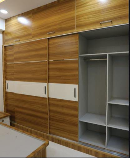 "Corner wardrobe with hanging rods, adjustable shelves, and drawers"