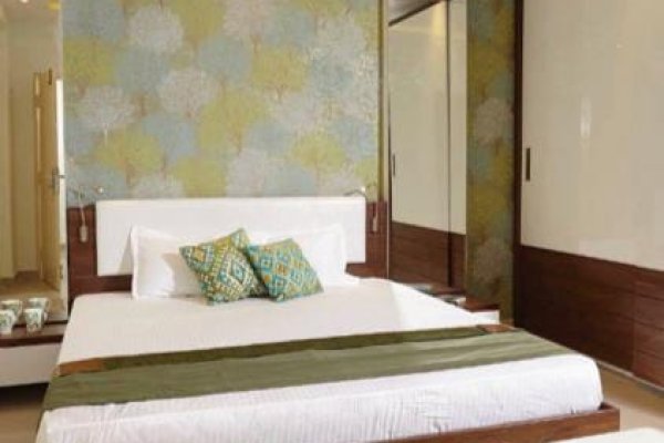 "A serene bedroom with minimalist decor and ergonomic furniture."