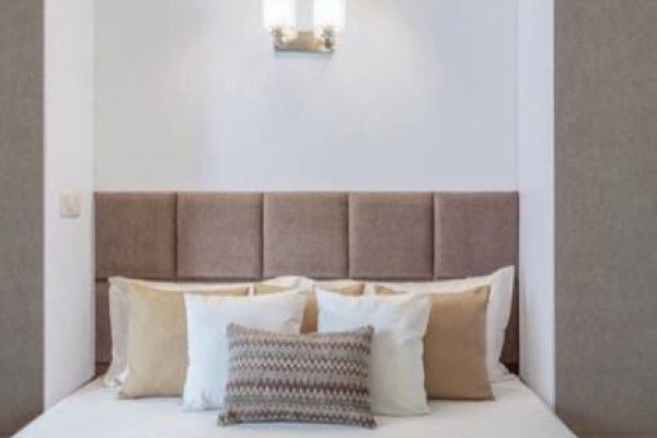 "Modern bedroom with clean lines and smart storage."