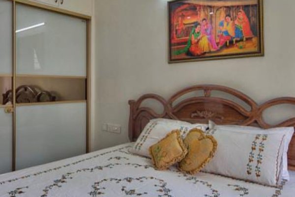 "Minimalist bedroom with ergonomic furniture and ample storage."