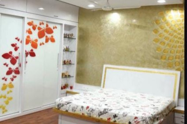 Elegant bedroom with minimalist decor and smart storage solutions."