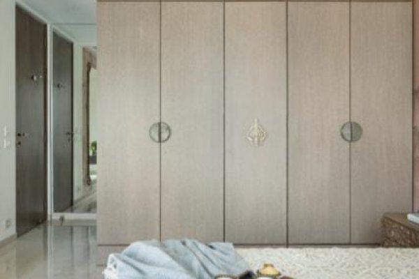 "Chic corner wardrobe with functional storage solutions"