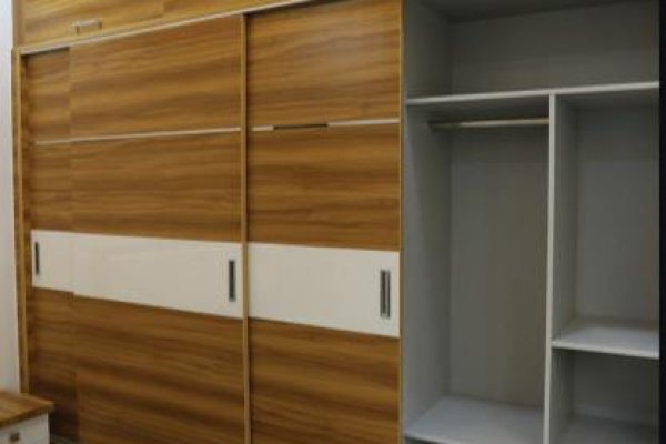 "Corner wardrobe with hanging rods, adjustable shelves, and drawers"